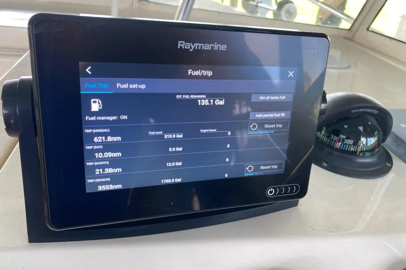 Slide: The Image of Control panel of a 2003 Mainship Pilot 30-II Sedan with Raymarine and Maretron displays. - 16