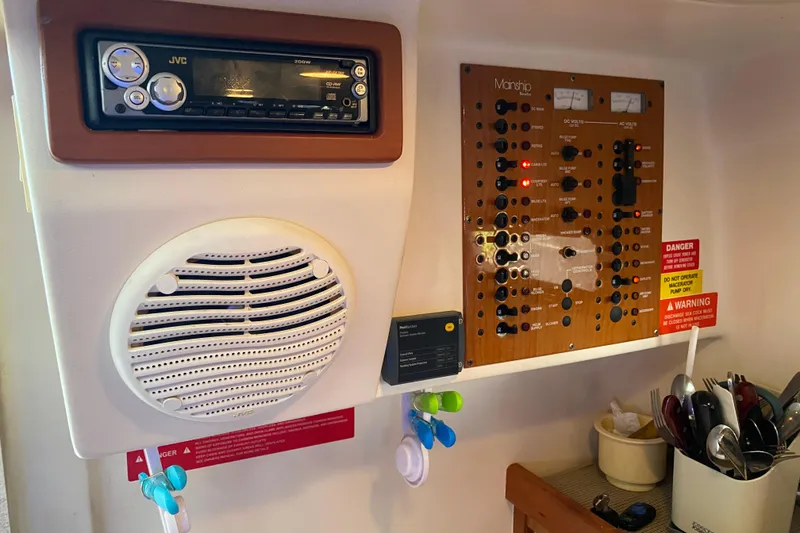 Slide: The Image of 2003 Mainship Pilot 30-II Sedan cabin interior with bed and cushions. - 27