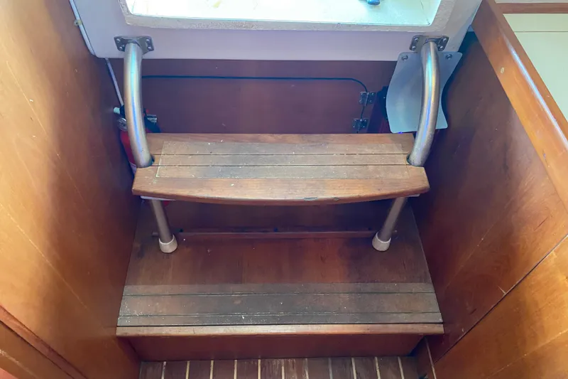 Slide: The Image of Control panel and audio system inside a 2003 Mainship Pilot 30-II Sedan boat. - 30