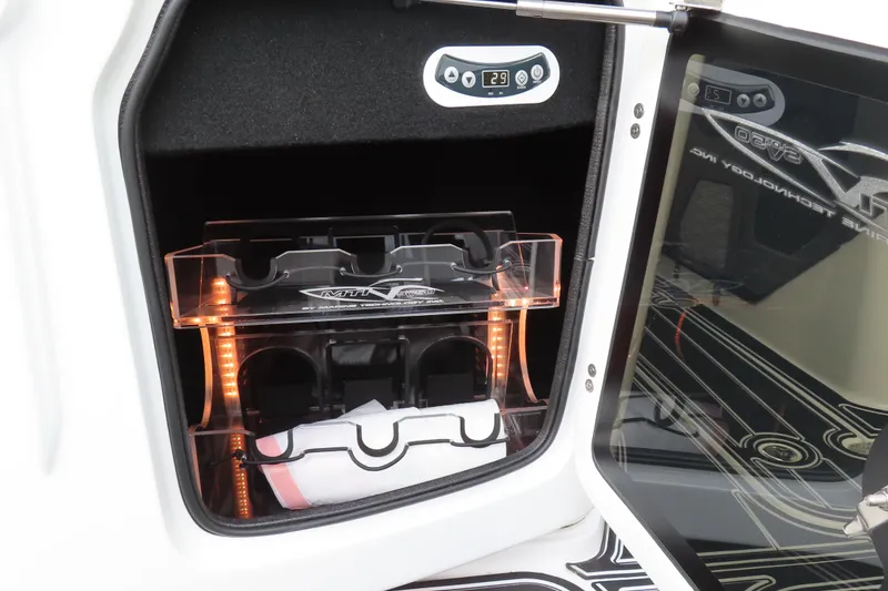 Slide: The Image of 2024 MTI 50v boat storage compartment with illuminated interior and control panel. - 12