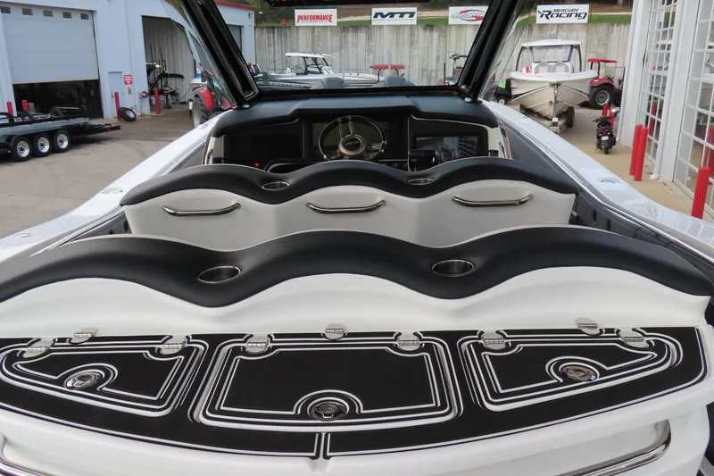 Slide: The Image of 2024 MTI 50v boat interior with sleek seating and modern dashboard design. - 13
