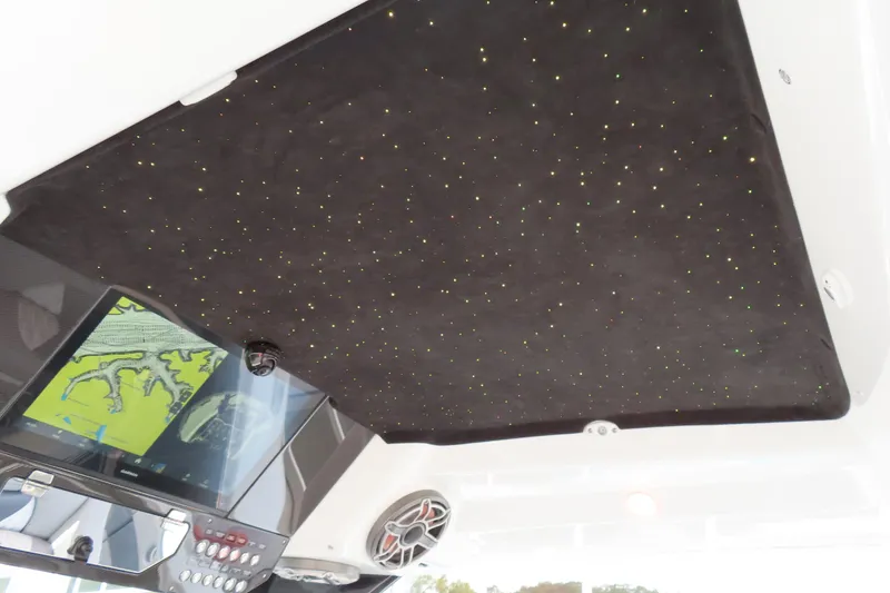 Slide: The Image of 2024 MTI 50v boat interior with starry ceiling and navigation display. - 15