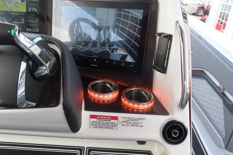 Slide: The Image of Dashboard of 2024 MTI 50v boat with touchscreen, controls, and illuminated cup holders. - 19