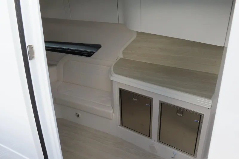 Slide: The Image of 2024 MTI 50v interior cabin with seating and storage compartments. - 25