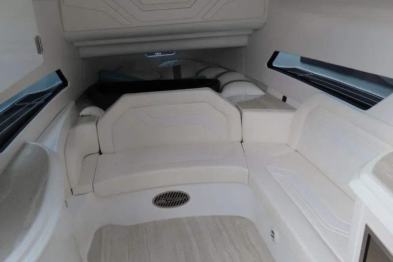 Slide: The Image of 2024 MTI 50v interior with white seating and modern design. - 26