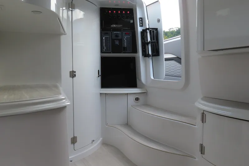 Slide: The Image of 2024 MTI 50v interior with control panel and sleek white design. - 28