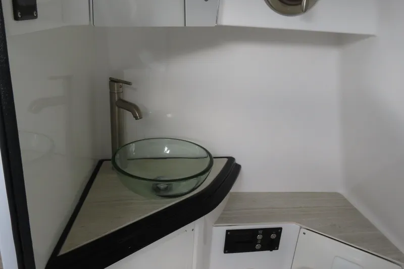 Slide: The Image of Modern bathroom sink with glass bowl and sleek faucet in 2024 MTI 50v model. - 30