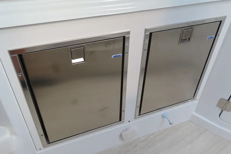 Slide: The Image of Stainless steel storage compartments on a 2024 MTI 50v boat. - 32
