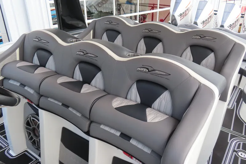 Slide: The Image of Luxurious seating on 2024 MTI 50v boat, featuring stylish gray and white upholstery. - 34