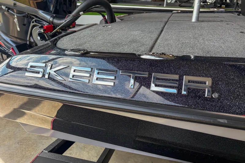 Slide: The Image of 2026 Skeeter ZXE20 boat with sleek design and metallic logo. - 10