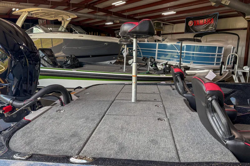 Slide: The Image of 2026 Skeeter ZXE20 boat in showroom, featuring spacious deck and seating. - 9