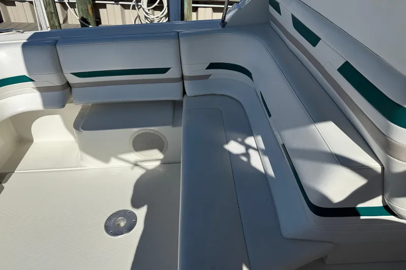 Slide: The Image of 1998 Formula 34 Performance Cruiser interior seating with white and teal accents. - 10