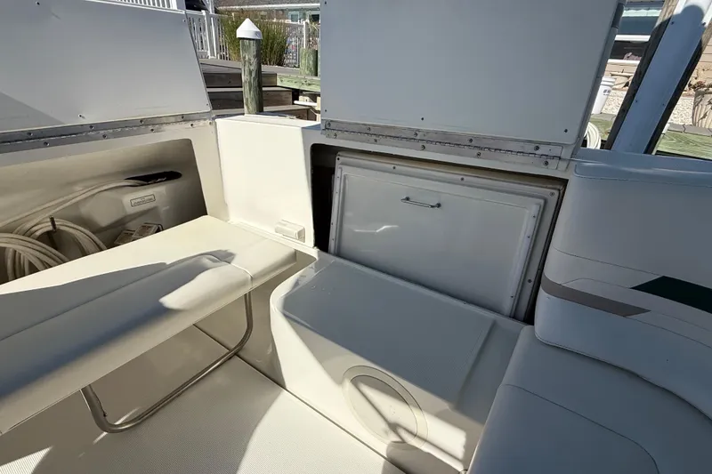 Slide: The Image of 1998 Formula 34 Performance Cruiser interior with seating and storage compartments. - 13