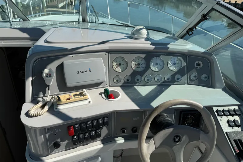 Slide: The Image of 1998 Formula 34 Performance Cruiser dashboard with Garmin navigation and control instruments. - 18