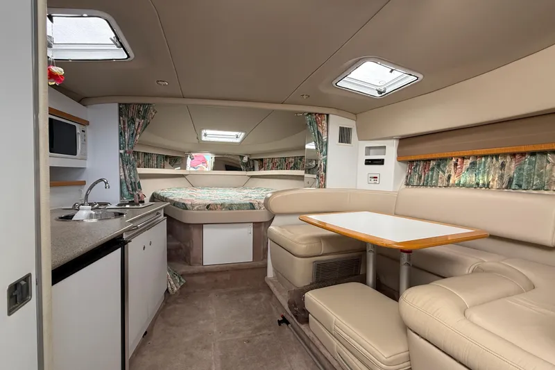 Slide: The Image of Interior of 1998 Formula 34 Performance Cruiser with kitchenette, dining area, and bed. - 24