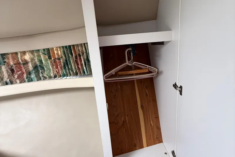 Slide: The Image of Interior of 1998 Formula 34 Performance Cruiser with open closet and hangers. - 27