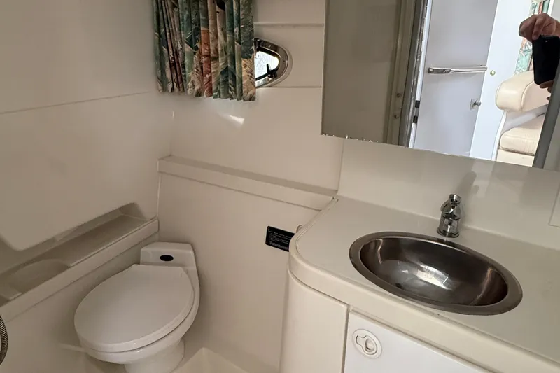 Slide: The Image of Bathroom interior of a 1998 Formula 34 Performance Cruiser with sink and toilet. - 34