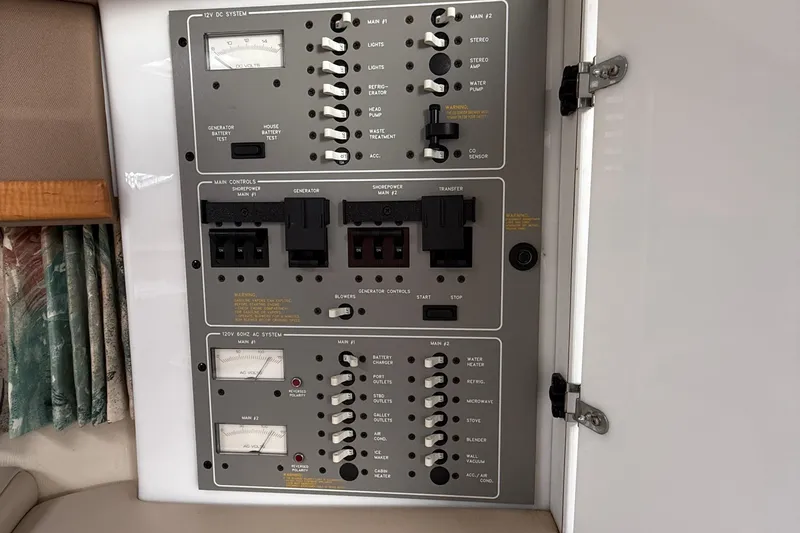 Slide: The Image of Control panel of a 1998 Formula 34 Performance Cruiser, featuring switches and gauges. - 35