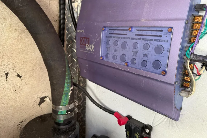 Slide: The Image of Sony XM 504X amplifier in a 1998 Formula 34 Performance Cruiser, with wiring and hoses. - 39