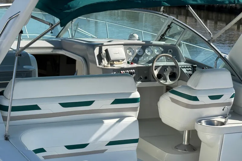 Slide: The Image of 1998 Formula 34 Performance Cruiser interior with white seating and control panel. - 7