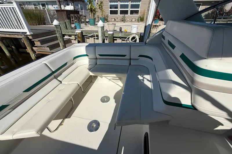 Slide: The Image of 1998 Formula 34 Performance Cruiser interior with white seating and green accents. - 8