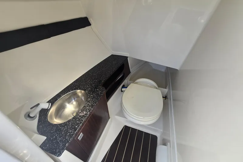 Slide: The Image of 2014 Monterey 288 Super Sport boat bathroom with sink and toilet. - 18