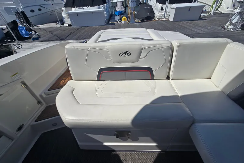 Slide: The Image of 2014 Monterey 288 Super Sport boat interior seating with white upholstery. - 24