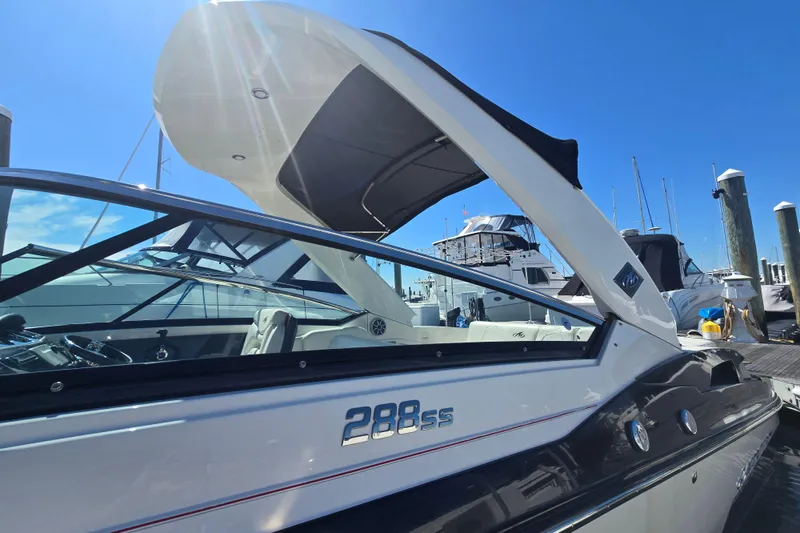 Slide: The Image of 2014 Monterey 288 Super Sport boat docked under clear blue sky. - 5