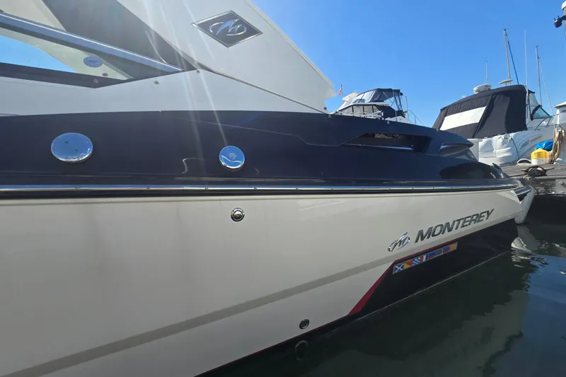 Slide: The Image of 2014 Monterey 288 Super Sport boat docked in marina under clear blue sky. - 6