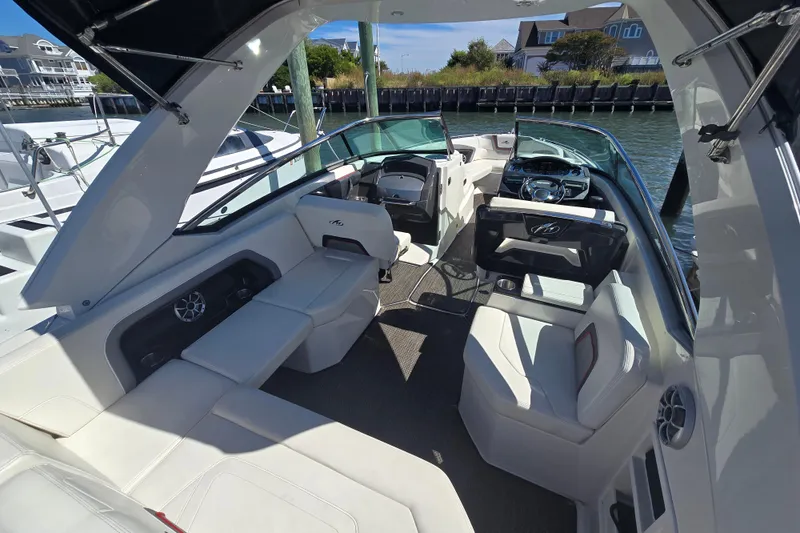 Slide: The Image of Luxurious interior of a 2014 Monterey 288 Super Sport boat, featuring spacious seating and modern design. - 8