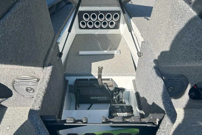 Slide: The Image of Interior of 2023 Lund 1775 Adventure Sport boat, featuring storage and electronic components. - 5