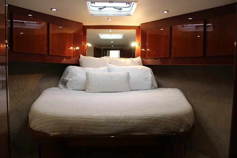Slide: The Image of Luxurious cabin interior of 2006 Egg Harbor 43 Sport Yacht with cozy bedding. - 11