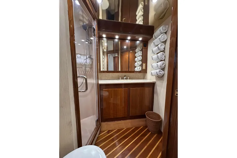 Slide: The Image of Luxurious bathroom in 2006 Egg Harbor 43 Sport Yacht with wood accents and modern fixtures. - 12