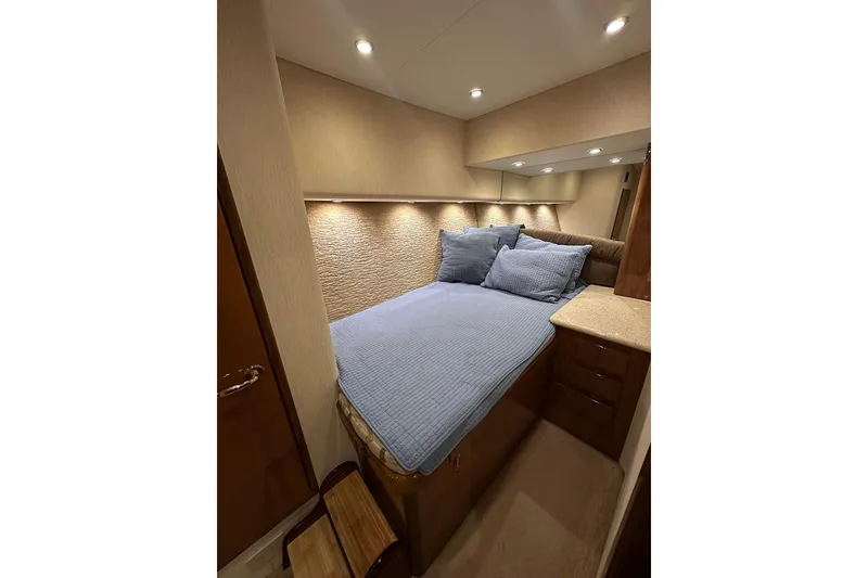 Slide: The Image of Luxurious bedroom interior of 2006 Egg Harbor 43 Sport Yacht with cozy bedding and ambient lighting. - 14