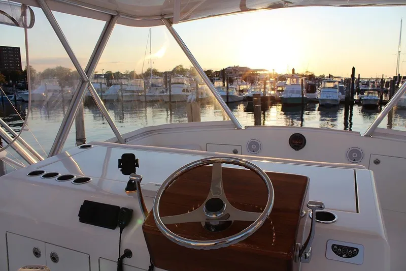 Slide: The Image of Egg Harbor 43 Sport Yacht 2006 helm with marina sunset view. - 15