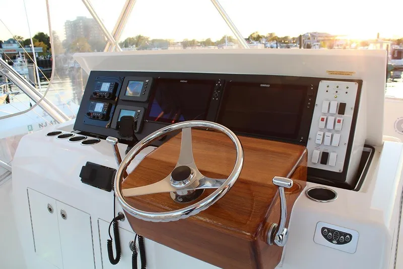 Slide: The Image of Helm of 2006 Egg Harbor 43 Sport Yacht with modern navigation controls. - 16