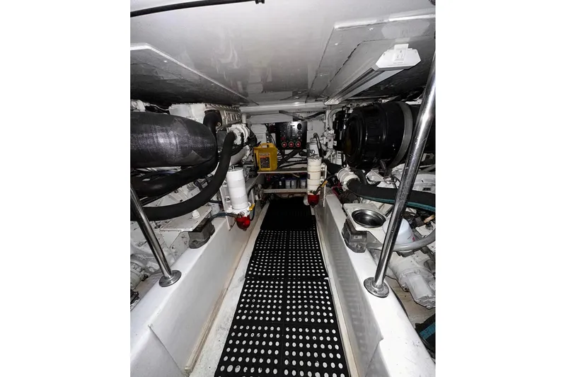 Slide: The Image of Engine room of a 2006 Egg Harbor 43 Sport Yacht, showcasing mechanical components. - 23