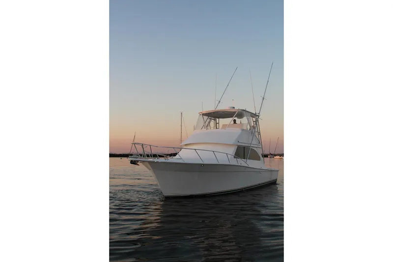 Slide: The Image of 2006 Egg Harbor 43 Sport Yacht on calm water at sunset. - 26