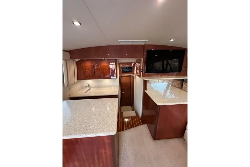 Slide: The Image of Interior of 2006 Egg Harbor 43 Sport Yacht with modern kitchen and wood finishes. - 5
