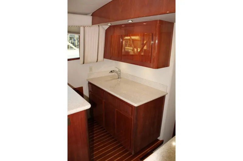 Slide: The Image of Luxurious wooden cabinetry and countertop in 2006 Egg Harbor 43 Sport Yacht interior. - 6