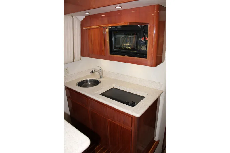 Slide: The Image of Luxurious kitchen area in a 2006 Egg Harbor 43 Sport Yacht with modern amenities. - 7