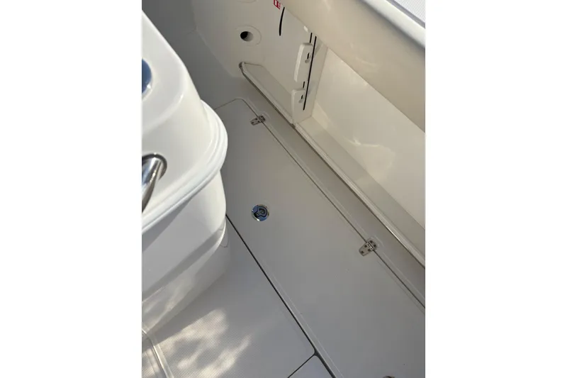 Slide: The Image of 2026 Boston Whaler 280 Outrage interior deck view, showcasing sleek design and functionality. - 6