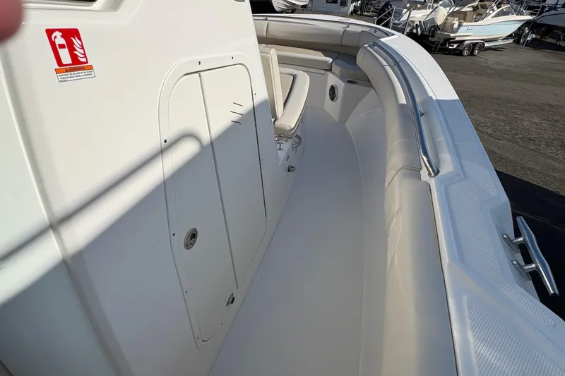 Slide: The Image of 2026 Boston Whaler 280 Outrage boat interior with seating and storage compartments. - 9