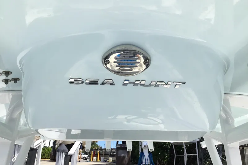 Slide: The Image of 2020 Sea Hunt Ultra 225 boat logo on white hull. - 25