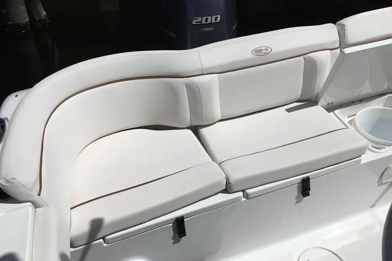 Slide: The Image of White cushioned seating on 2020 Sea Hunt Ultra 225 boat, featuring Yamaha 200 engine. - 37