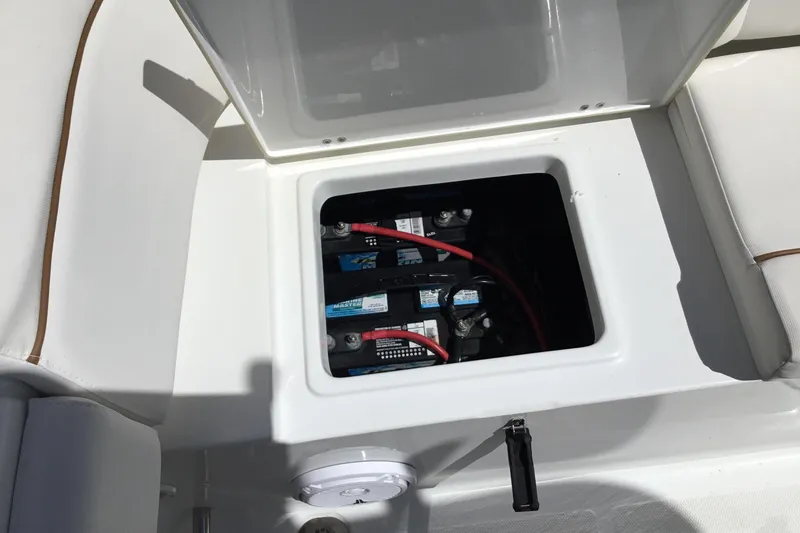 Slide: The Image of Battery compartment of a 2020 Sea Hunt Ultra 225 boat, showing wiring and connections. - 40