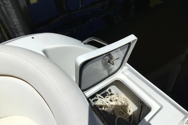 Slide: The Image of Storage compartment on a 2020 Sea Hunt Ultra 225 boat with ropes inside. - 46