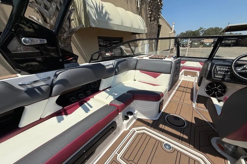 Slide: The Image of 2019 Moomba Makai boat interior with stylish seating and modern dashboard design. - 10