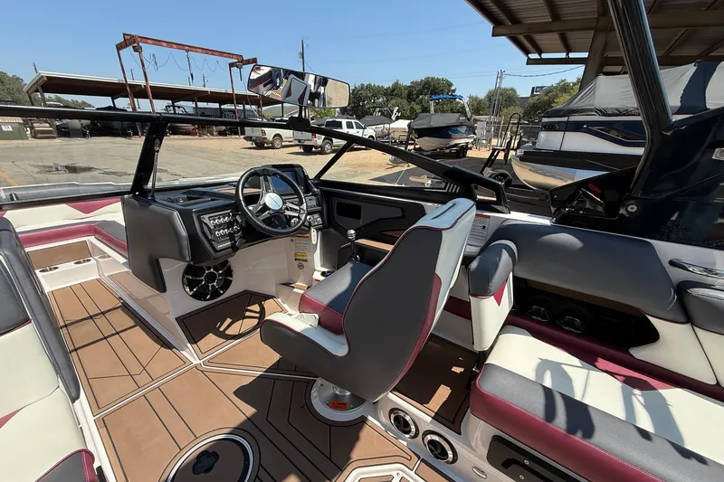 Slide: The Image of 2019 Moomba Makai boat interior with modern dashboard and seating, featuring sleek design elements. - 11