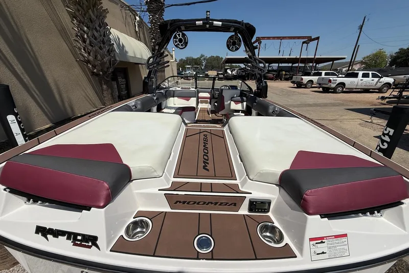 Slide: The Image of 2019 Moomba Makai boat interior with seating and Raptor engine branding. - 9